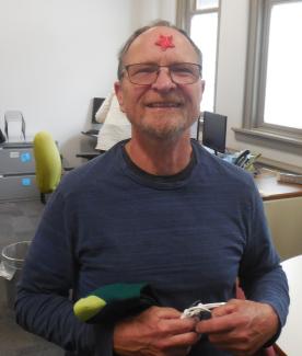 Brian smiling with a star sticker on his forehead