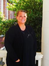 Kay C standing outside of Old Main